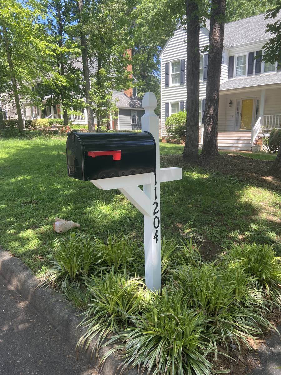 Standard mailbox replacement, white post set into a planted bed