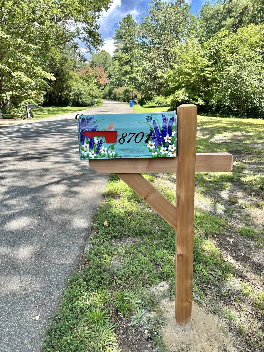 Hand-painted floral mailbox on a new cedar post